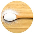 Granulated sugar in wooden spoon on bamboo cutting board, on bamboo cutting board Royalty Free Stock Photo