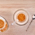 Granules of instant coffee in glass cup. Top view Royalty Free Stock Photo