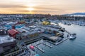 Granville Island Marina and Fishermen Wharf Float. Vancouver city buildings skyline in the background. Royalty Free Stock Photo