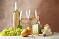 Grape, cheese, pears, glasses and bottle with wine, on white background Royalty Free Stock Photo