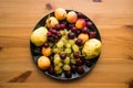 Grape, cherry, apricot and pear in a black table Royalty Free Stock Photo