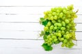 Grape. Fresh white grapes on a white wooden background.