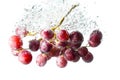 Grape fruits fall deeply under water Royalty Free Stock Photo