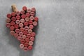Grape made of wine corks with different dates on grey table, top view. Space for text Royalty Free Stock Photo