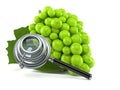 Grape with magnifying glass Royalty Free Stock Photo