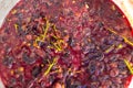 grape pomace in a bucket after being squeezed and pressed to make wine. Red pulp grapes