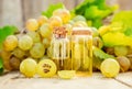 Grape seed oil in a small jar. Selective focus.