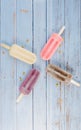 Grape, Strawberry; Chocolate, Vanilla Popsicle in Blue Background