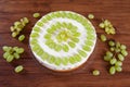 Grape torte with green grapes on cake plate