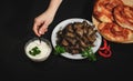 Grape vines leaves stuffed with meat, rice and vegetables with sour cream. Sarmale, dolma, sarma, golubtsy or golabki with cheese Royalty Free Stock Photo