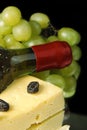 Grape wine with cheese on black Royalty Free Stock Photo