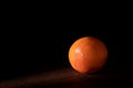 Grapefruit with black background in negative space