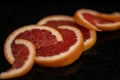 Grapefruit close up on black stone background