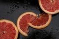 Grapefruit close up on black stone background Royalty Free Stock Photo