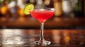 Grapefruit cocktail with lime slice, an enticing twist on the bar counter. Royalty Free Stock Photo