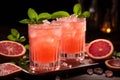 Grapefruit cocktail in tall glasses with ice hype Royalty Free Stock Photo