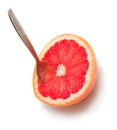Grapefruit with the dessertspoon Royalty Free Stock Photo