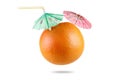 Grapefruit with drinking straw and umbrella isolated on white Royalty Free Stock Photo