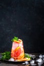 Grapefruit and fresh mint cocktail with juice, cold summer citrus refreshing drink or beverage with ice Royalty Free Stock Photo