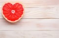 grapefruit fruit slice heart shape on white wooden table top view