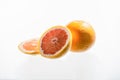 Grapefruit and grapefruit half isolated on white background. Pink,orange Fresh grapefruit citrus fruit, slice with zest Royalty Free Stock Photo