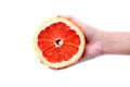 Grapefruit in hand on a white background Royalty Free Stock Photo