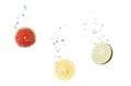 Grapefruit, lemon, lime in water with air bubbles Royalty Free Stock Photo