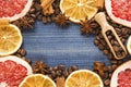 Grapefruit and lemon slices, coffee beans, cinnamon, star anise and wooden spoon on blue wooden background Royalty Free Stock Photo