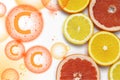 Grapefruit and lemon slices on white background. Tropical bright juicy fruit vegetarian healthy dietary supplement of