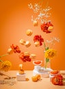 Grapefruit macarons and yellow-orange tulips fly on orange background Royalty Free Stock Photo