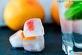 Fruit in ice cubes in water Royalty Free Stock Photo