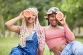 Grapefruit, smile and friends on a picnic in a park in Australia during summer. Portrait of happy African women on a