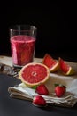 Grapefruit and strawberries juice still life Royalty Free Stock Photo