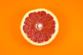 Grapefruit texture inside on the orange background. Citrus close up photo. Healthy food. Awesome wallpaper. Vegetarian and vegan