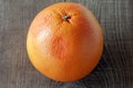 Grapefruit on wooden background. Royalty Free Stock Photo