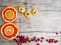grapefruits, lemon, cydonia slices, red cranberries, top view. Natural vitamins and antioxidants food concept