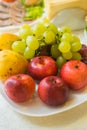 Grapes, apples and pears on a plate