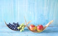 Grapes and apples on rustic table, dieting, healthy nutrition, fitness, copy space