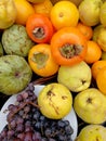 Grapes and autumn fruits in a table Royalty Free Stock Photo