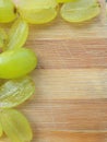 Grapes border on wooden background Royalty Free Stock Photo