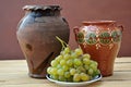 Grapes and clay pots Royalty Free Stock Photo