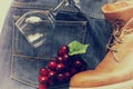 Grapes on a jeans and boot and glass . effact vintage style blu
