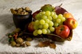 Grapes nuts and apples Royalty Free Stock Photo