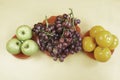 Grapes,Oranges and Apples put on background