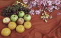 Grapes,Oranges and Apples put beside Gold miniature with Chinese auspicious words