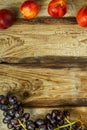 Grapes and peaches on a wooden table. Copy space. Royalty Free Stock Photo