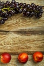 Grapes and peaches on a wooden table. Copy space. Royalty Free Stock Photo