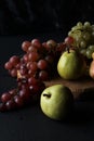 Grapes and pears fruits on a black background Royalty Free Stock Photo