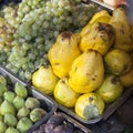 Grapes, quince, tangerines, figs in containers Royalty Free Stock Photo