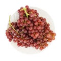 grapes seedless red on dish isolated on white background Royalty Free Stock Photo